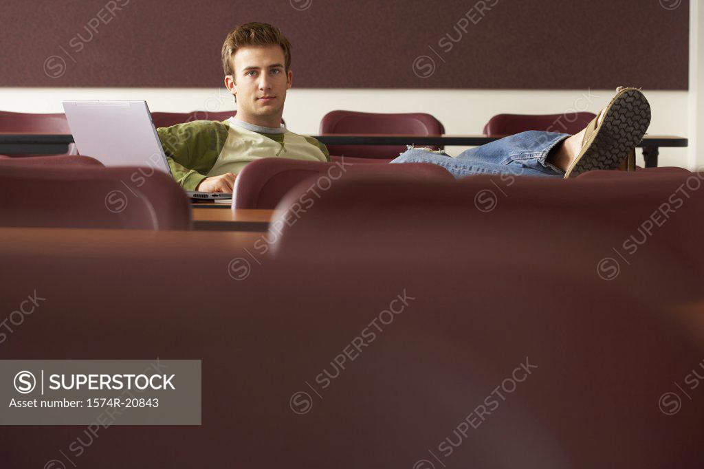 Stock Photo: 1574R-20843 College student sitting in a lecture hall