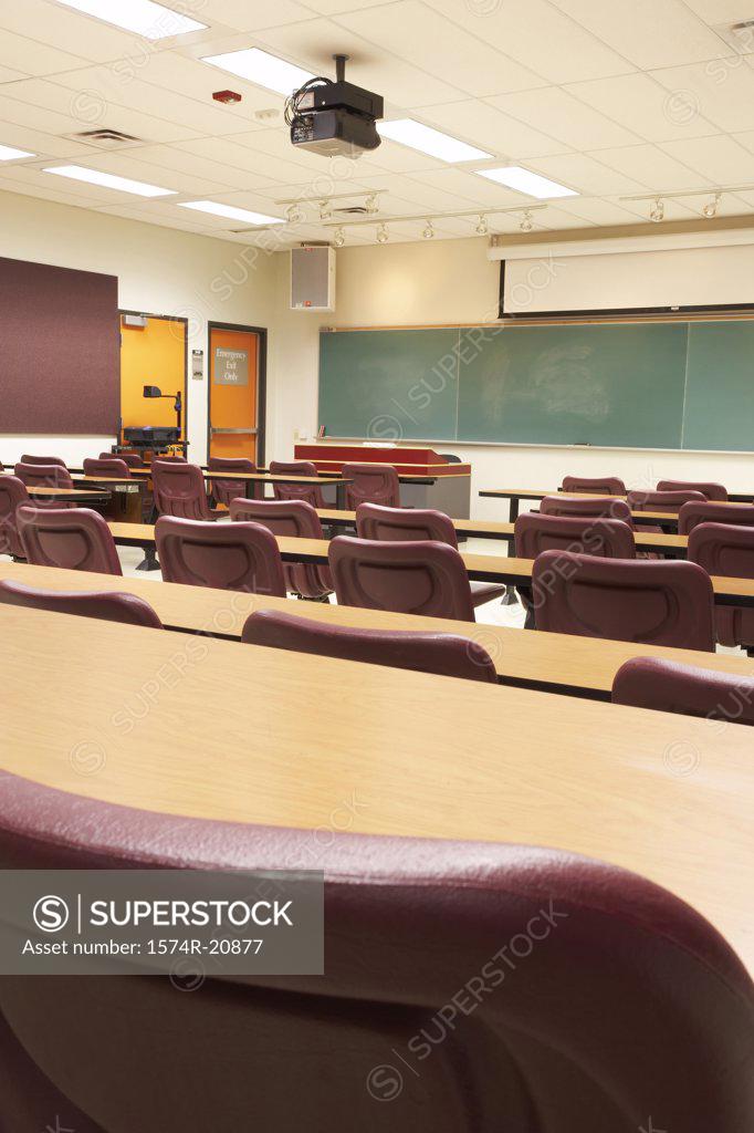 Stock Photo: 1574R-20877 Empty tables and chairs in a lecture hall