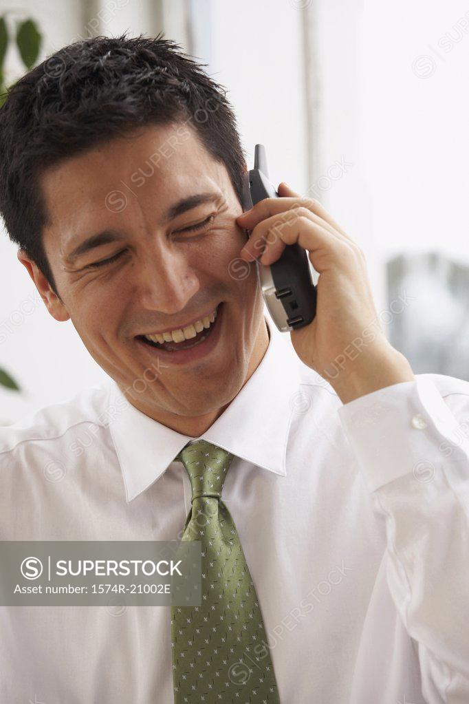 Stock Photo: 1574R-21002E Close-up of a businessman talking on the phone