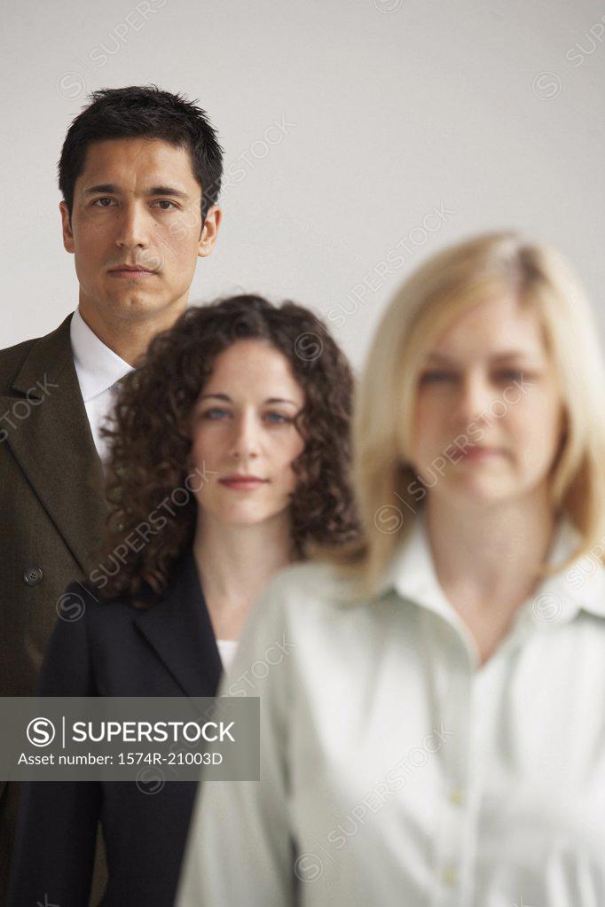 Stock Photo: 1574R-21003D Portrait of two businesswomen and a businessman standing in a row
