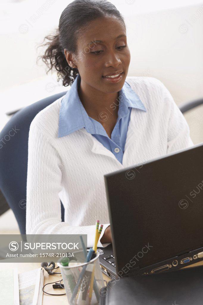 Stock Photo: 1574R-21013A High angle view of a businesswoman using a laptop