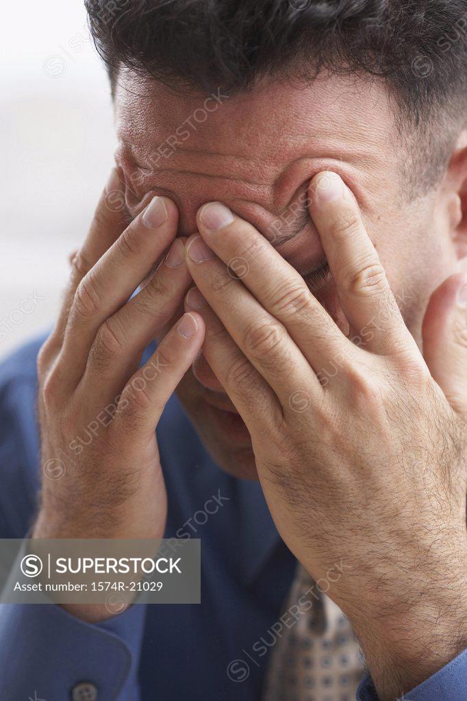 Stock Photo: 1574R-21029 Close-up of a businessman suffering from a headache