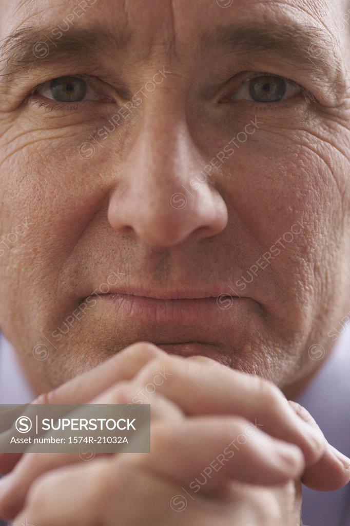 Stock Photo: 1574R-21032A Portrait of a businessman looking serious
