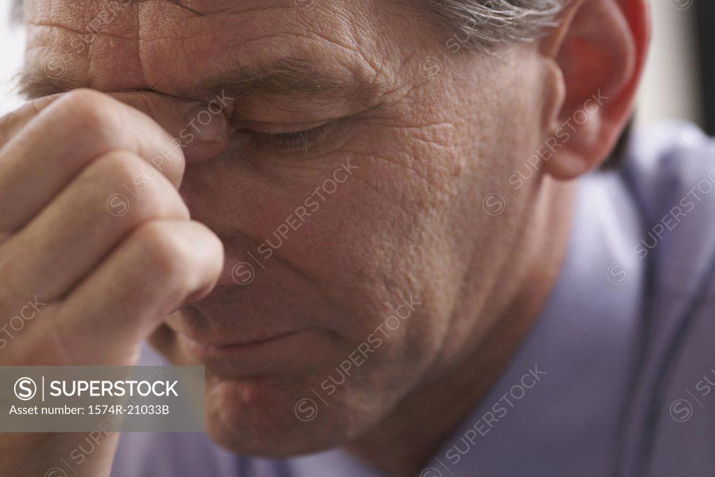 Stock Photo: 1574R-21033B Close-up of a businessman thinking