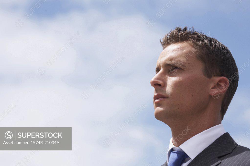 Stock Photo: 1574R-21034A Side profile of a businessman looking serious