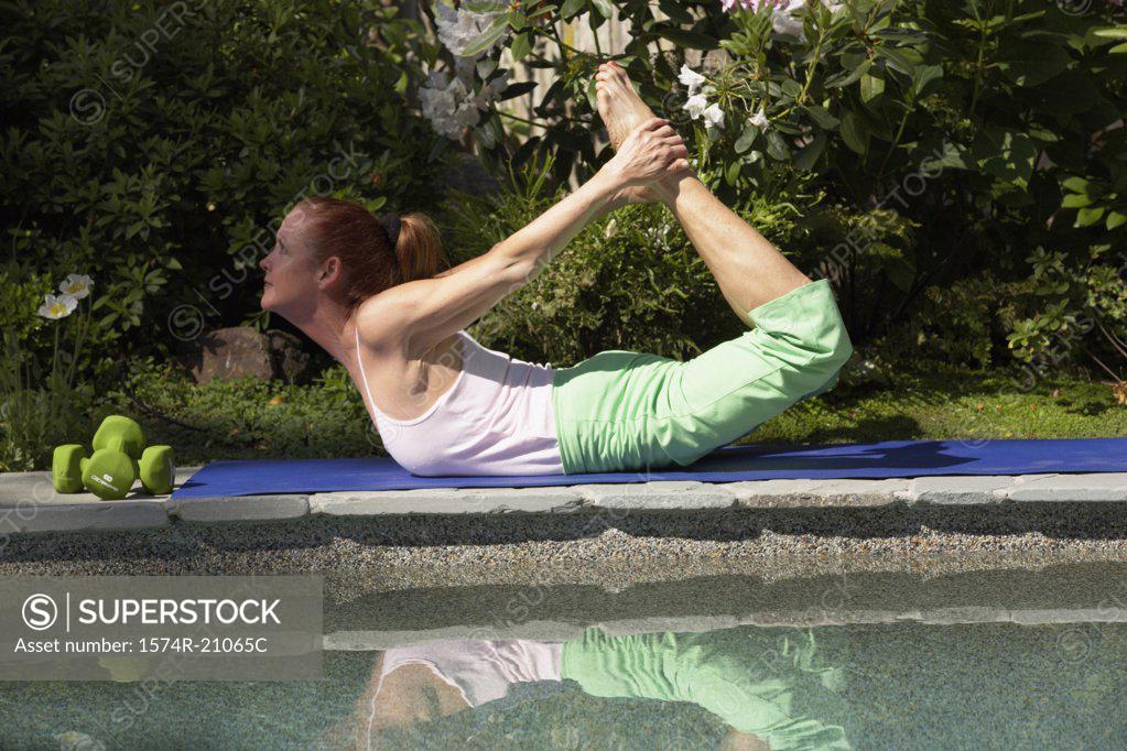 Stock Photo: 1574R-21065C Side profile of a mature woman exercising