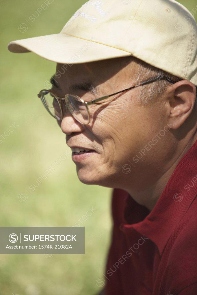 Stock Photo: 1574R-21082A Side profile of a mature man smiling
