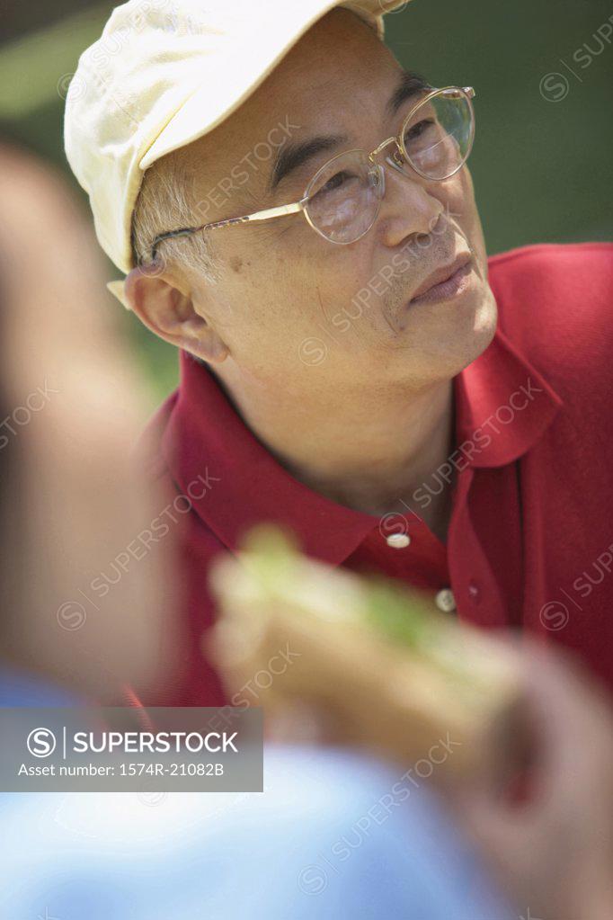 Stock Photo: 1574R-21082B Close-up of a mature man in front of a mature woman