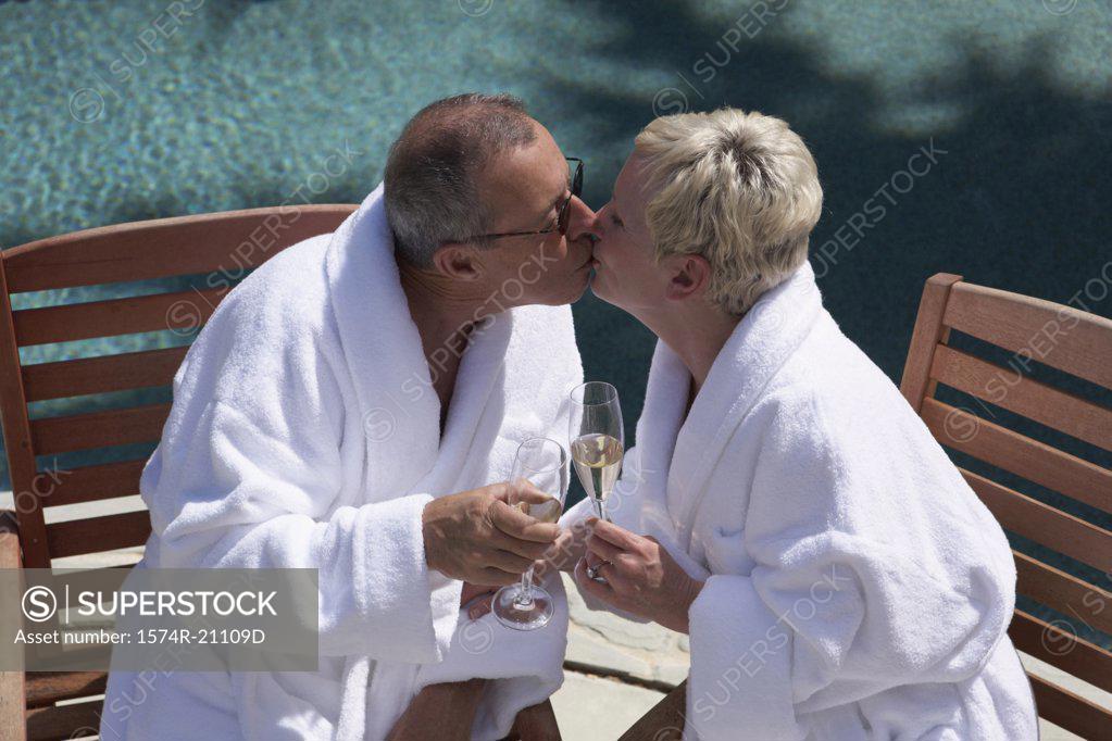 Stock Photo: 1574R-21109D Close-up of a mature couple kissing each other