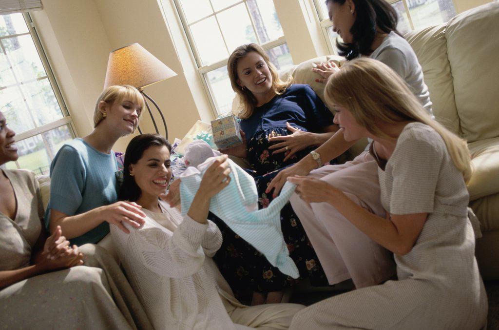Group of young women sitting together at a baby shower