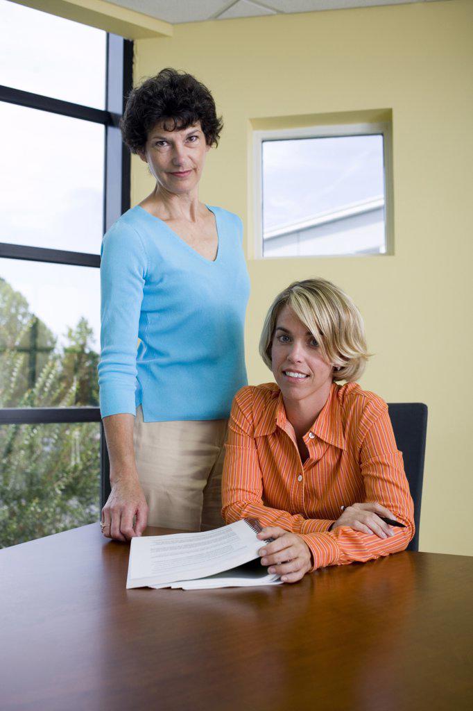 Portrait of two businesswomen in an office