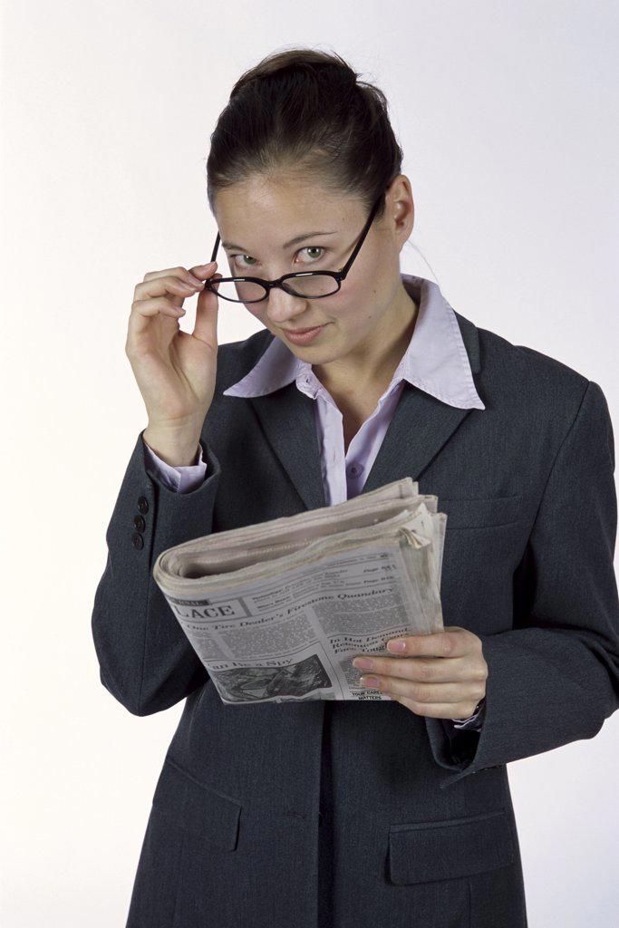 Portrait of a businesswoman holding a newspaper