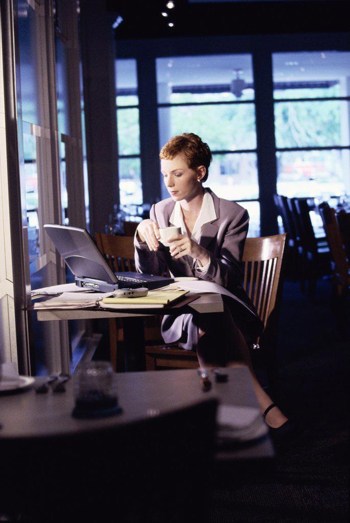 Businesswoman sitting in a restaurant