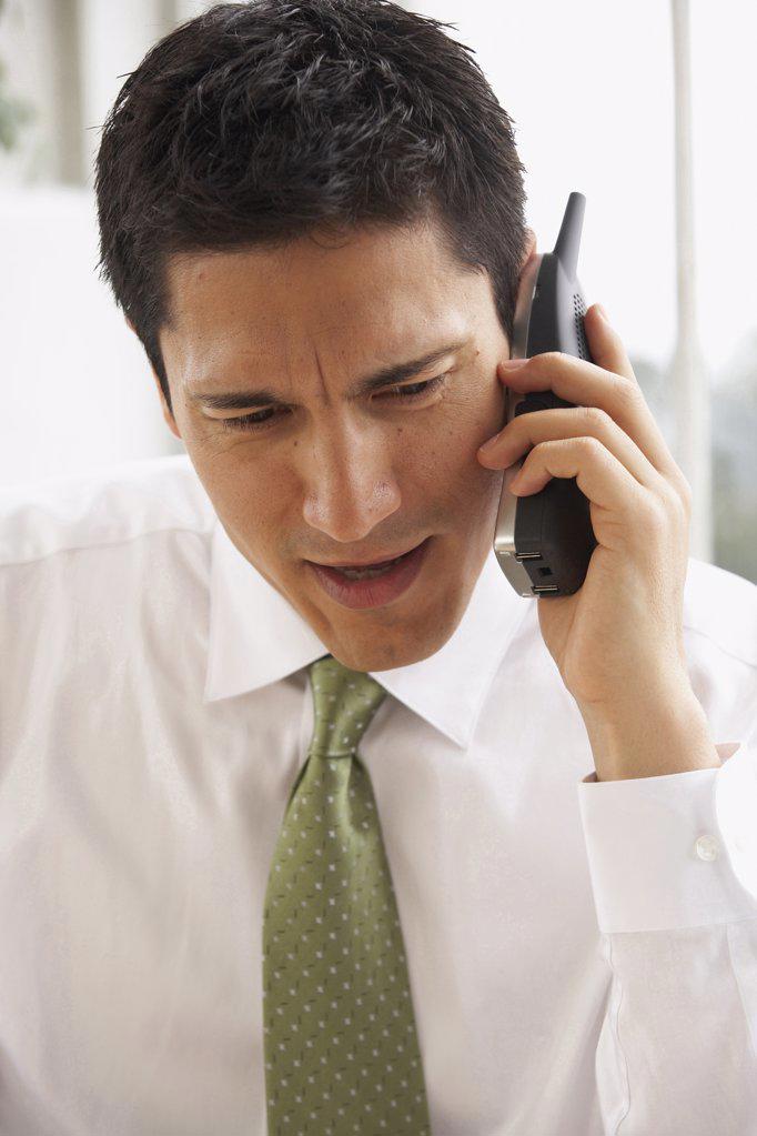 Close-up of a businessman talking on the phone