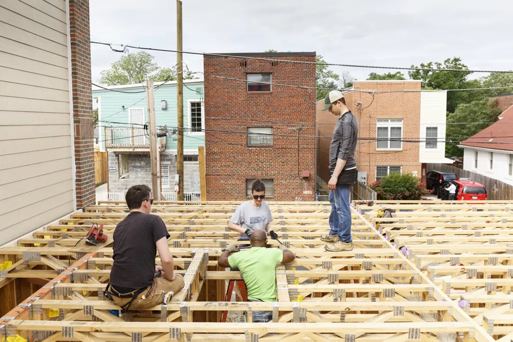 Volunteers on the roof at construction site