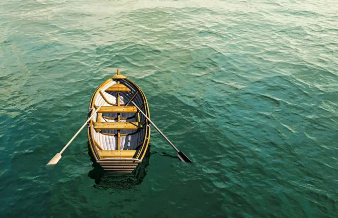 Abandoned rowboat in ocean