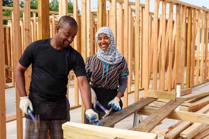 Black volunteers building house