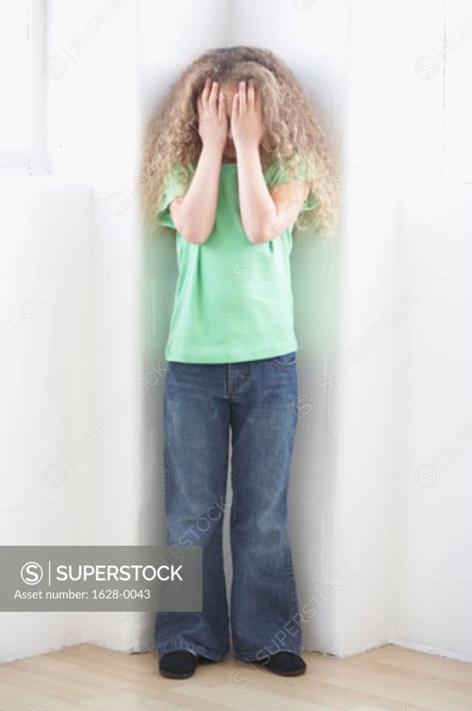 Stock Photo: 1628-0043 Girl hiding her face with her hands