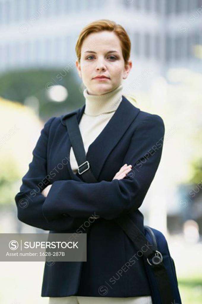 Stock Photo: 1628-287B Portrait of a businesswoman standing with her arms crossed