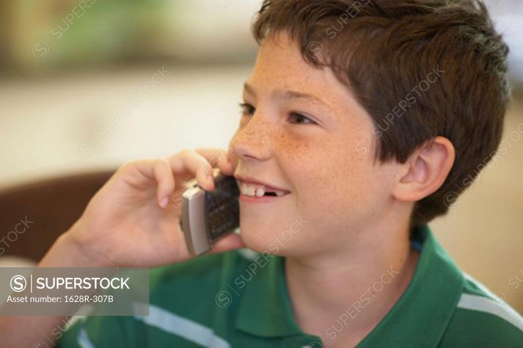 Stock Photo: 1628R-307B Close-up of a boy talking on a mobile phone