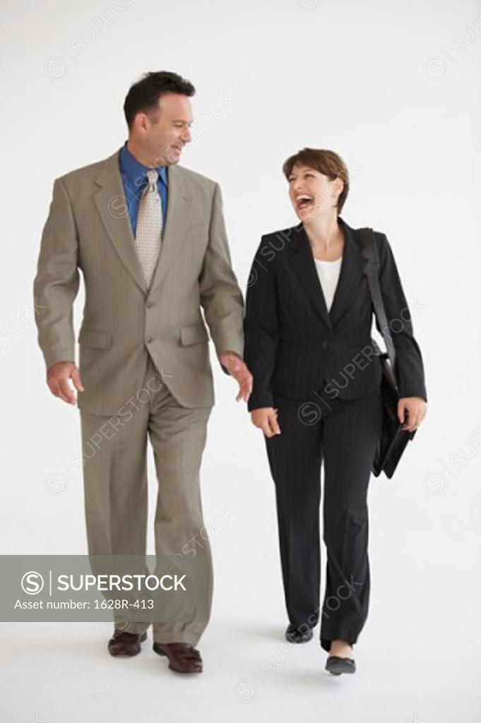Stock Photo: 1628R-413 Businessman and a businesswoman walking