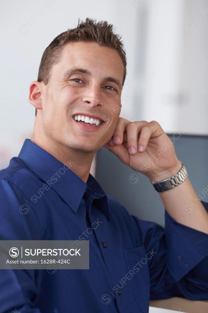 Stock Photo: 1628R-424C Portrait of a businessman smiling