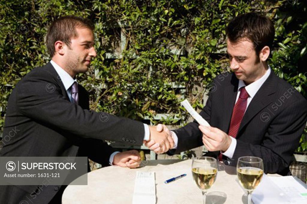 Stock Photo: 1631-121 Close-up of two businessmen shaking hands