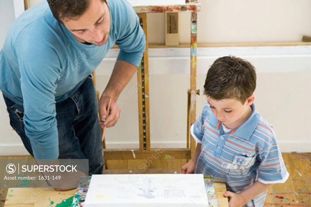 Stock Photo: 1631-149 Close-up of a father drawing with his son