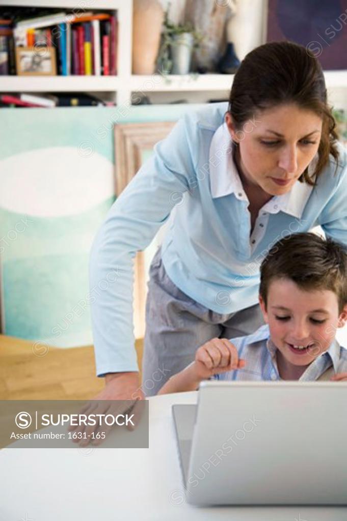 Stock Photo: 1631-165 Young woman and her son using a laptop