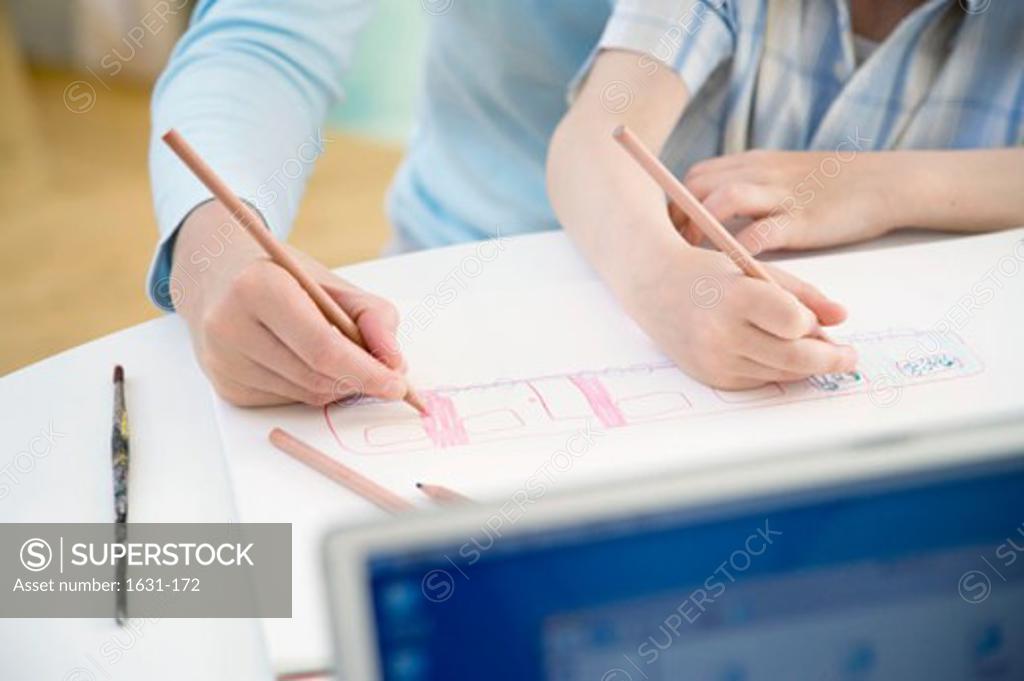Stock Photo: 1631-172 Mid section view of a woman drawing with her son