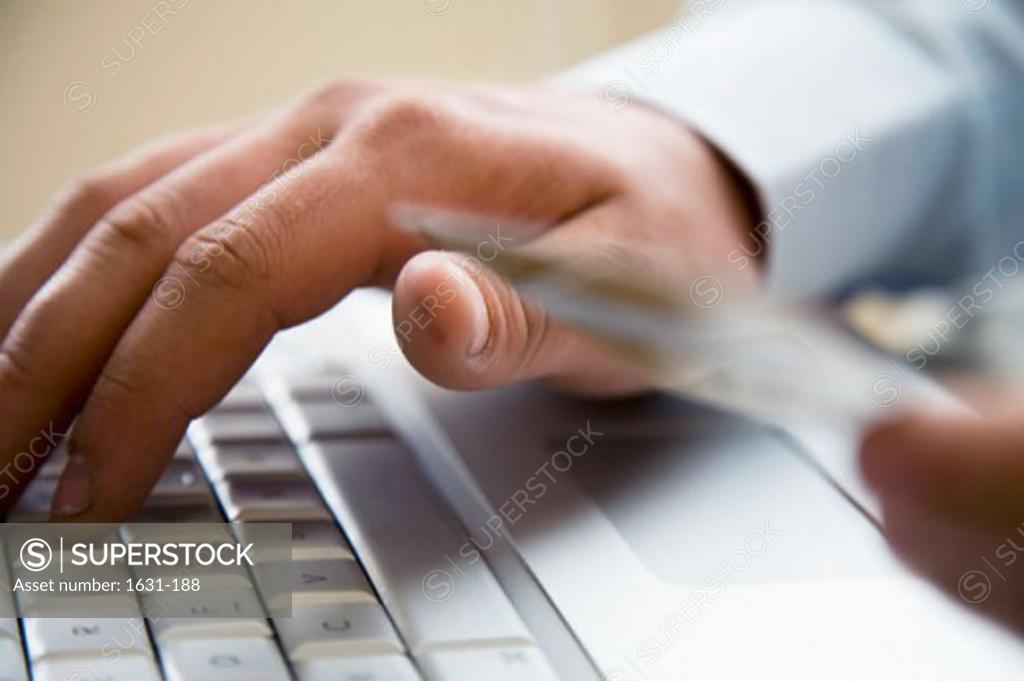 Stock Photo: 1631-188 Close-up of a man's hand using a laptop