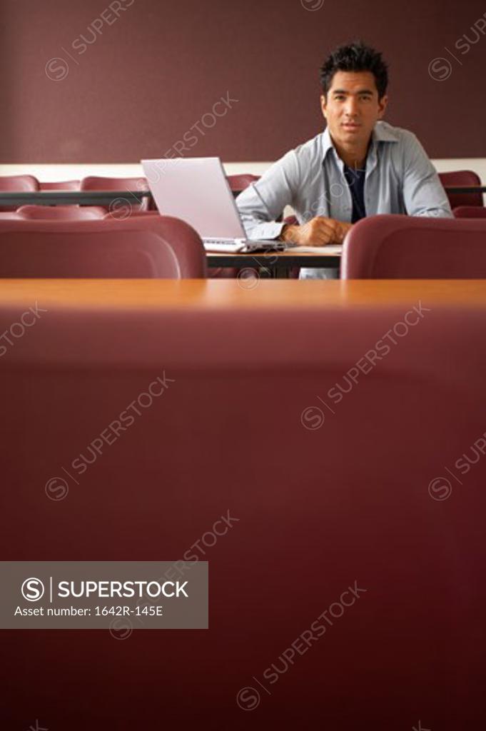 Stock Photo: 1642R-145E Portrait of a college student sitting in a lecture hall