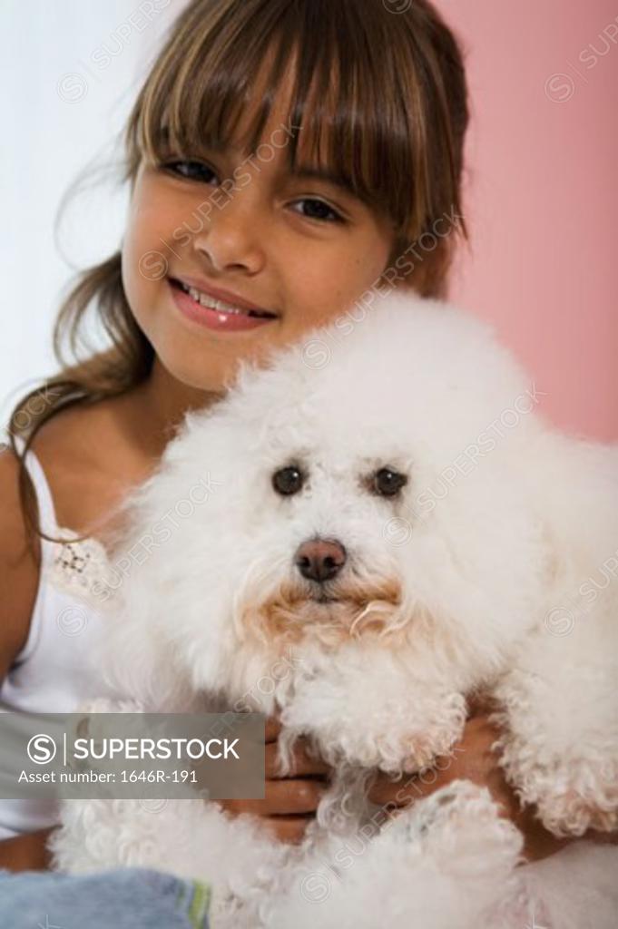 Stock Photo: 1646R-191 Portrait of a girl hugging her dog and smiling