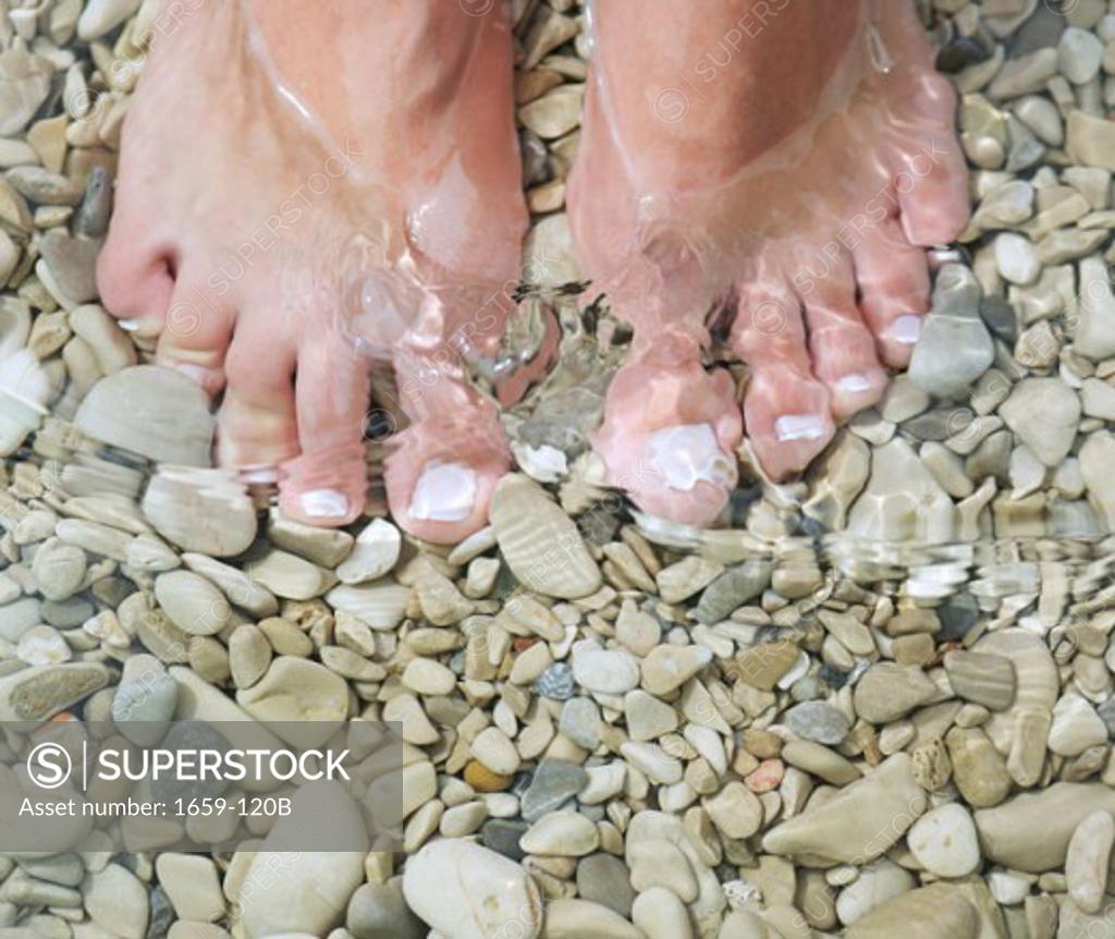 Stock Photo: 1659-120B Low section view of a woman on the beach