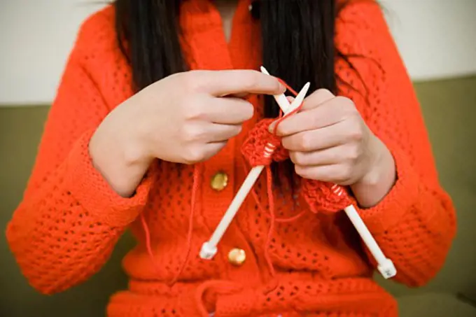 young woman knitting