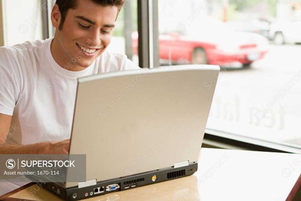 Stock Photo: 1670-114 Close-up of a teenage boy using a laptop