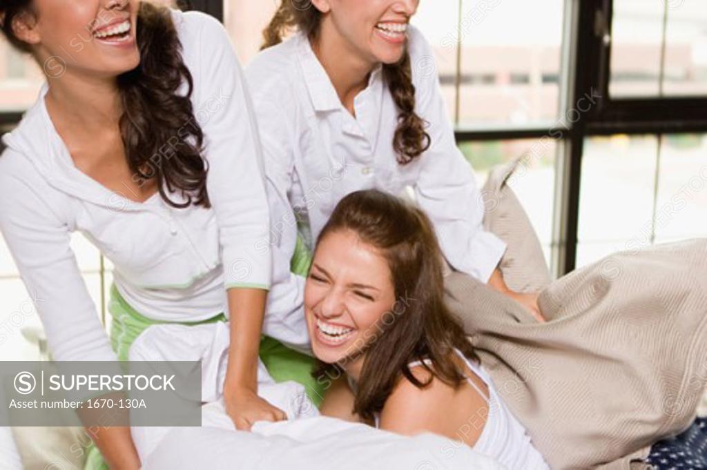Stock Photo: 1670-130A Close-up of three young women laughing