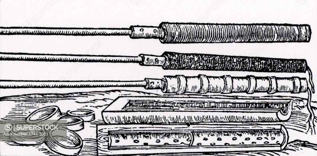 Stock Photo: 1746-5021 Moulds for making fire tubes.  These were fired from cannon, either at enemy forces or for setting fire to wooden gates.  From De la pirotechnia by Vannoccio Biringuccio (Venice, 1540).  Woodcut.