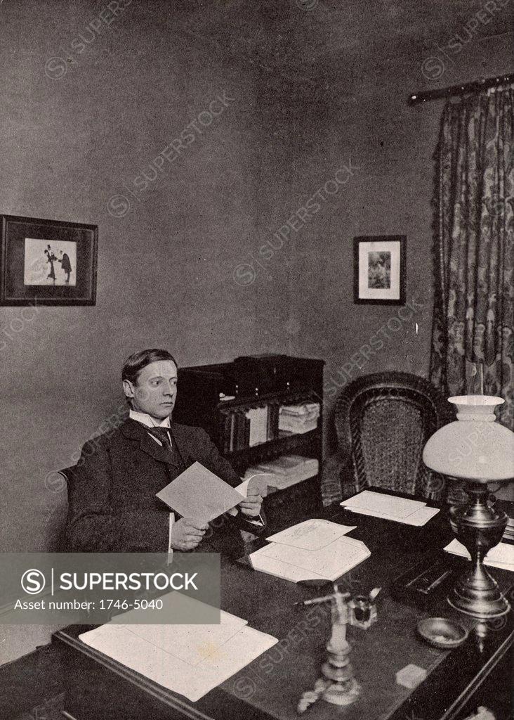 Stock Photo: 1746-5040 WW Jacobs. Wiliam Wymark Jacobs (1863-1943) English short story writer, born at Wapping, London, best remembered for his short stories which ranged from the humorous to the macabre such as The Monkey's Paw.  Jacobs in his study at Buckhurst Hill, Essex, England.