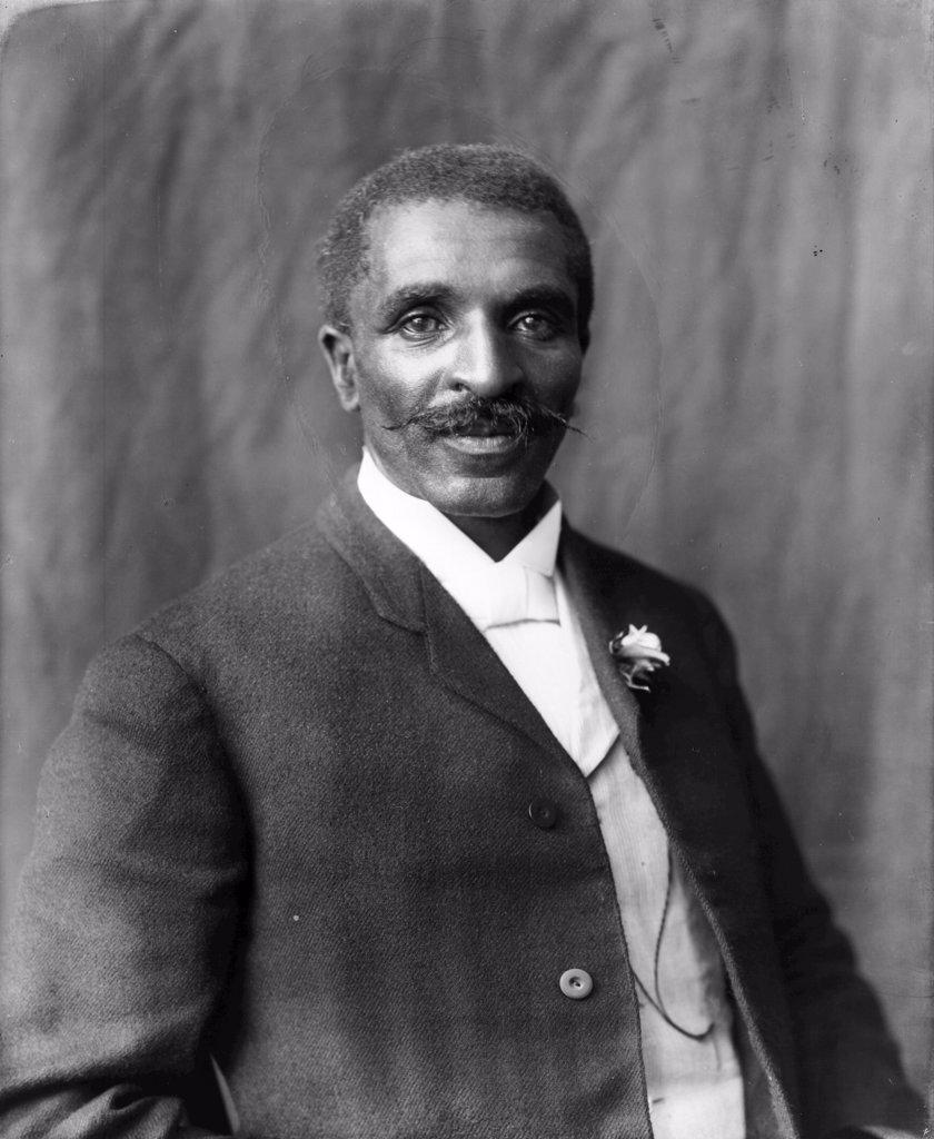 Photographic print of George Washington Carver (born into slavery in 1861or1864 - 1943), half-length portrait, facing right, Tuskegee Institute, Tuskegee, Alabama by Benjamin Frances Johnston, (1864-1952).