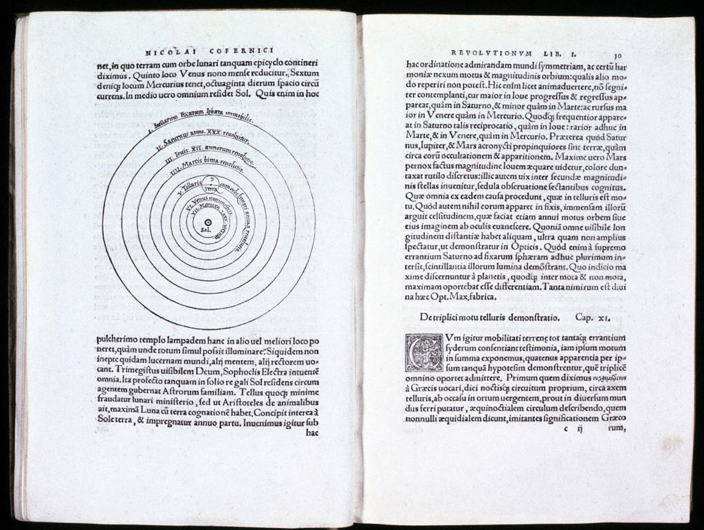 Nicolas Copernicus (1473-1543) Polish astronomer.  Spread of his De revolutionibus orbium coelestium Nuremberg 1543, showing diagram of his heliocentric (sun-centred) theory of the universe.