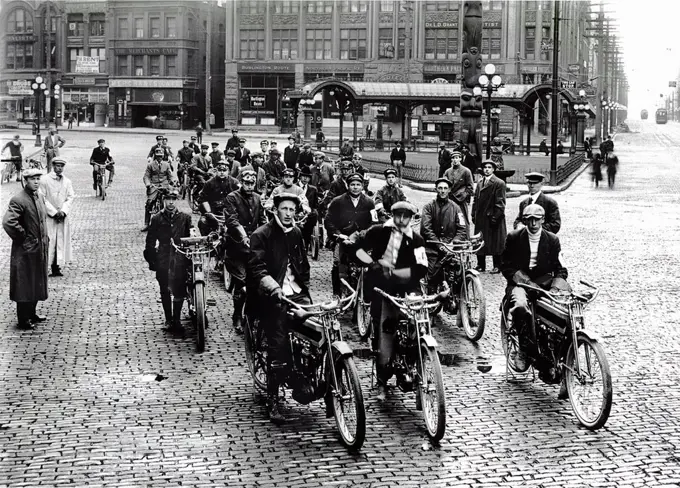 Photograph of a motorcycle gang sitting on their bikes in Seattle. Dated 1914