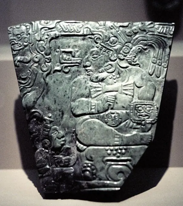 Jade plaque showing Mayan king seated, 400-800.
