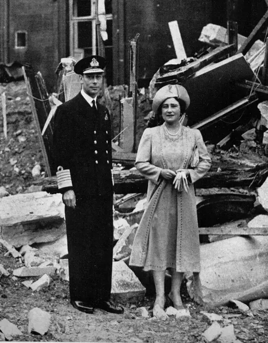 King George V and Queen Elizabeth, stand in the ruins of Buckingham Palace after an air raid in World War II