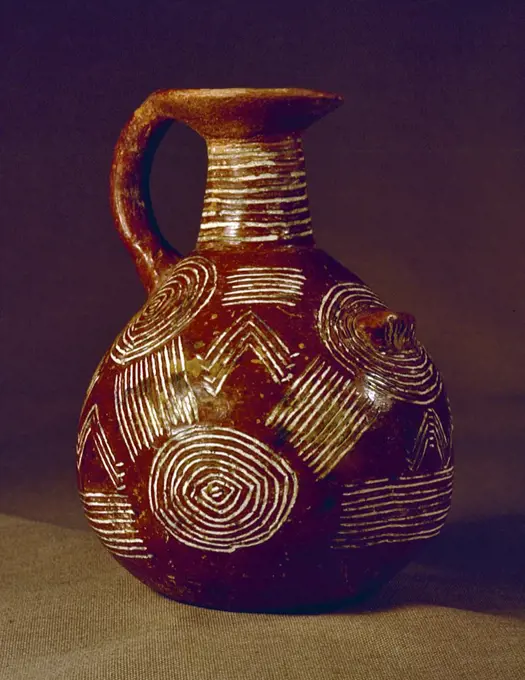 Jug with round base and round spout, Incised Red Polished Ware, Early Bronze Age, 2000 BC. from Cyprus.