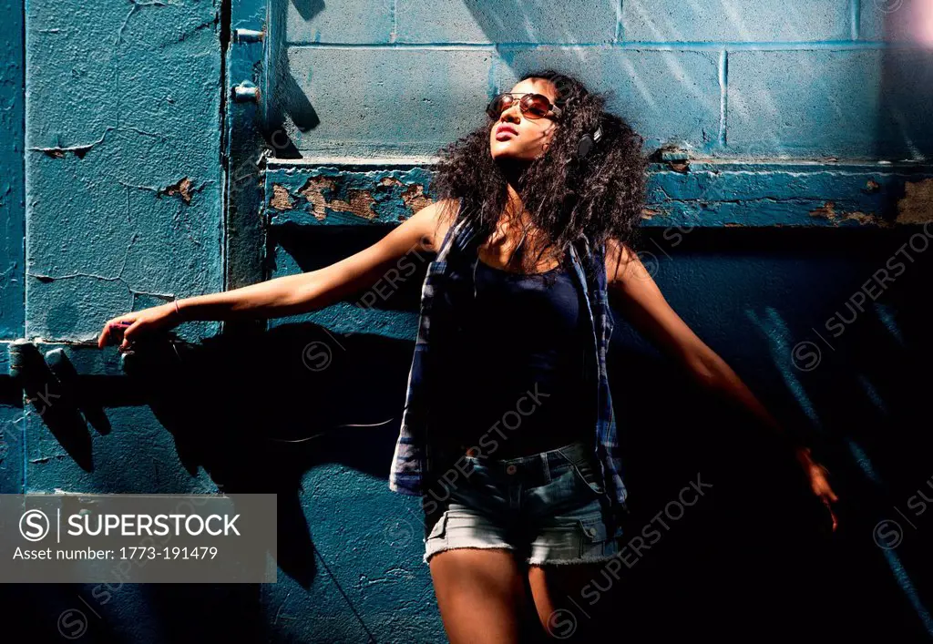 Young woman wearing sunglasses in urban setting
