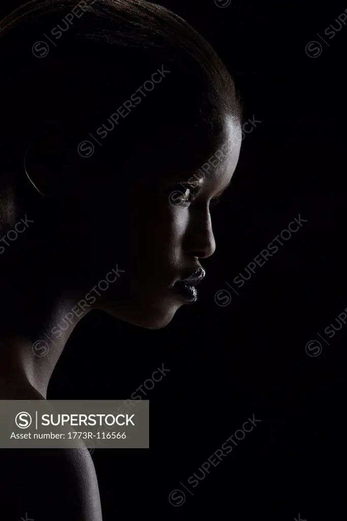 Profile of woman on black background