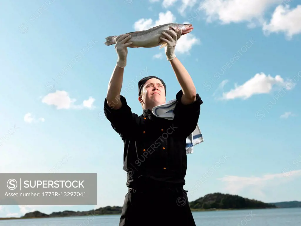 Chef holding fish