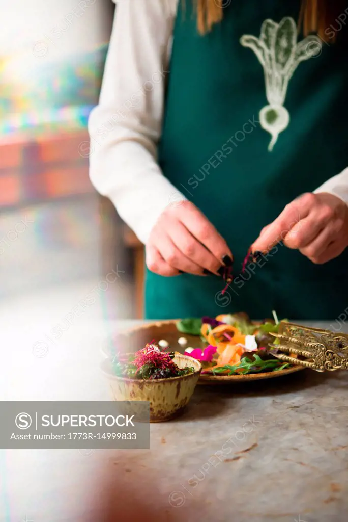 Woman preparing vegan dish