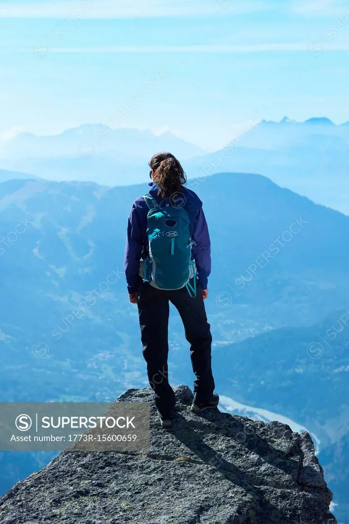 Mountain climber at summit, Chamonix, Rhone-Alps, France